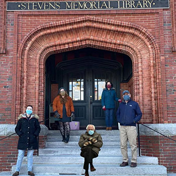 SML staff photo with Bernie Sanders meme graphic